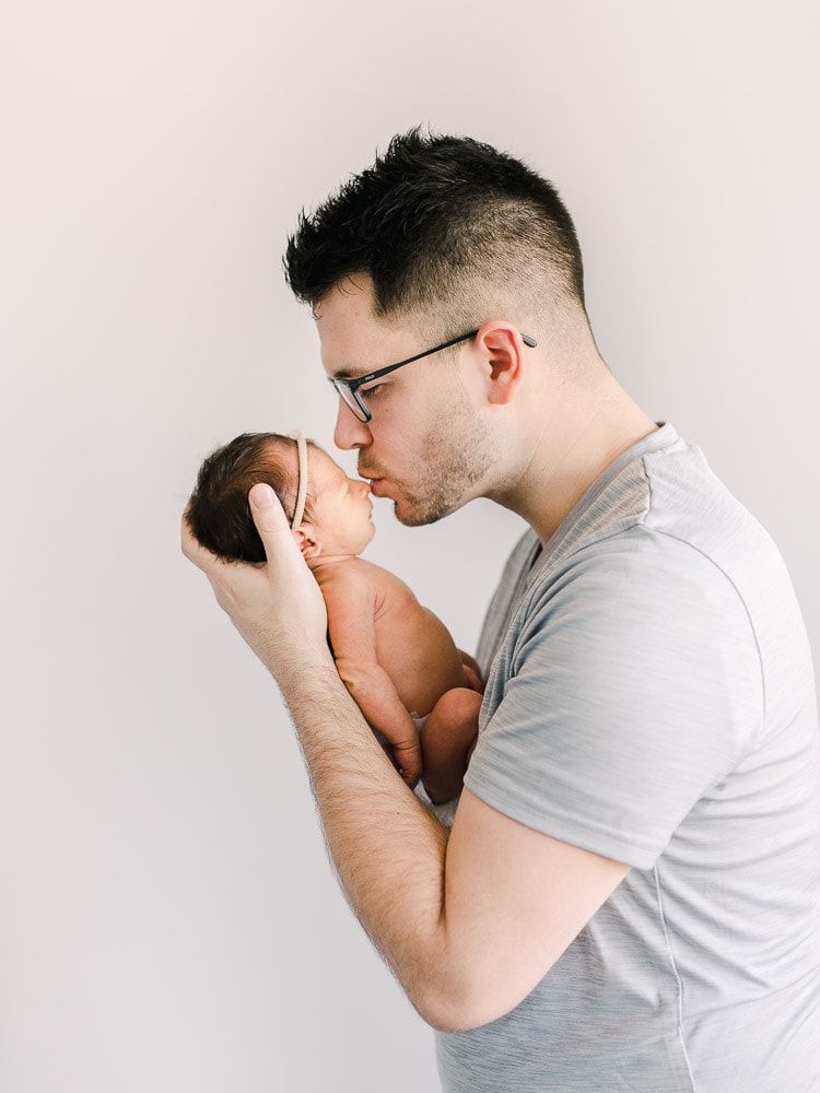 Newborn with dad, In-home newborn photography photo inspiration by Juliana Kaderbek Photography, Cleveland Newborn Photographer