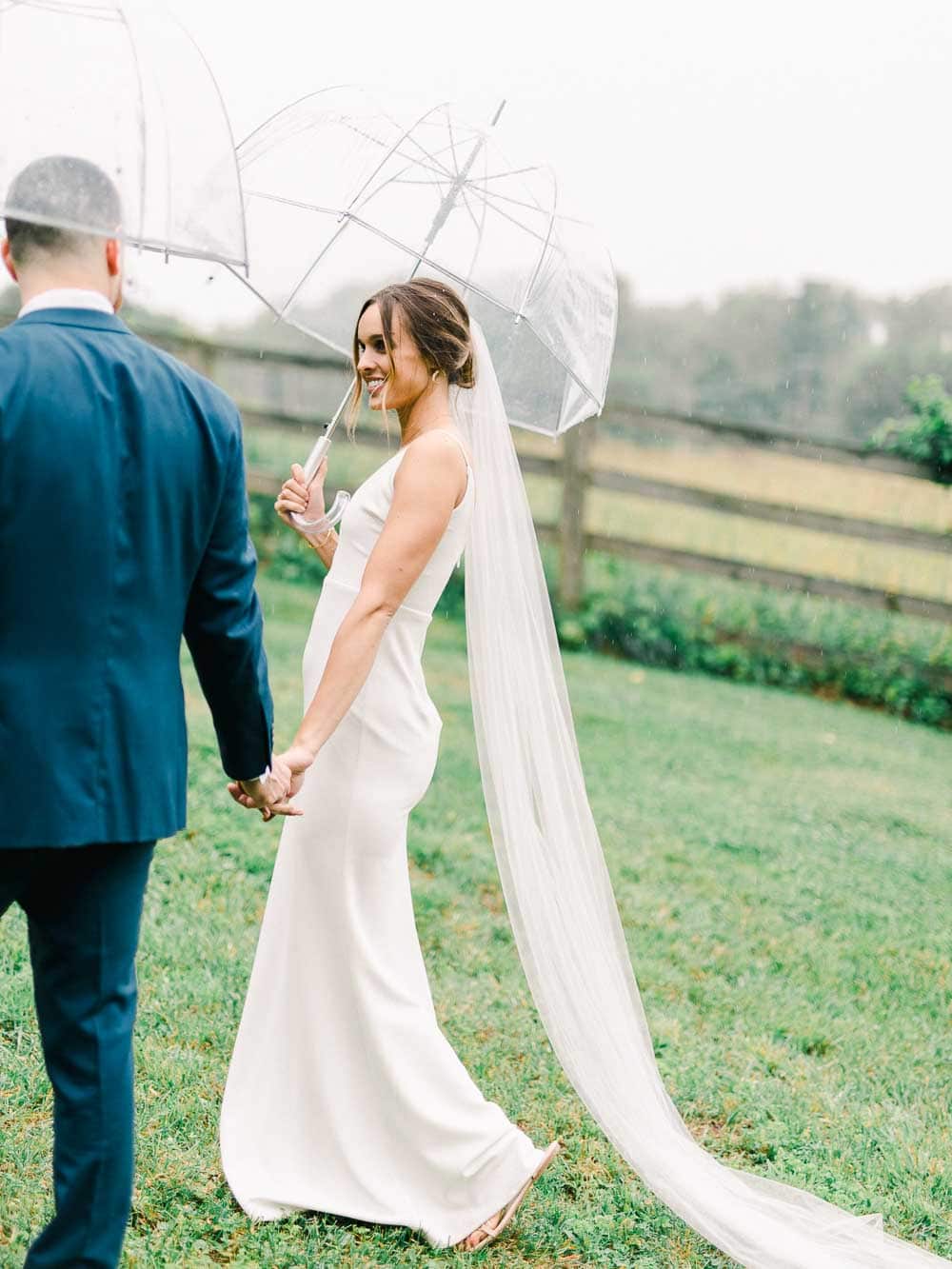rainy bride and groom portrait during their intimate backyard wedding in cleveland Ohio