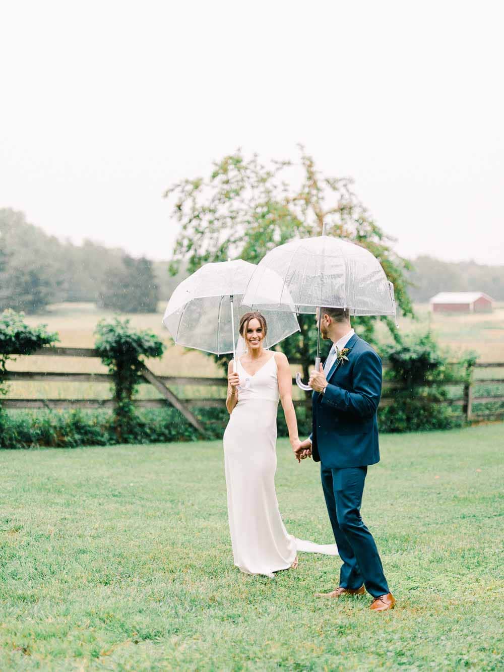 rainy bride and groom portrait during their intimate backyard wedding in cleveland Ohio