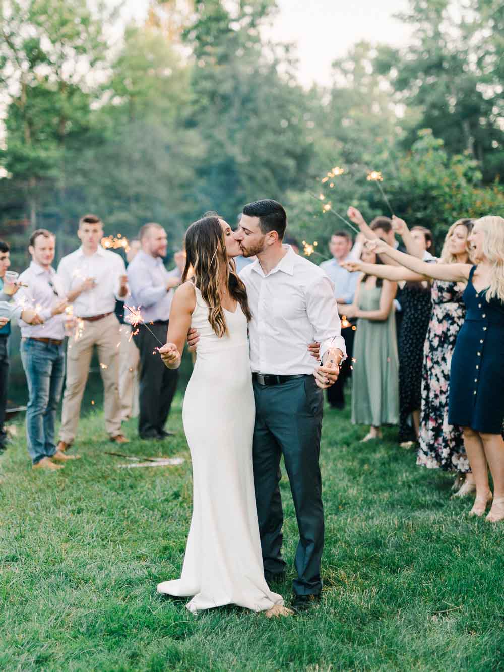 bride and groom sparkler exit portrait during their intimate backyard wedding in cleveland Ohio