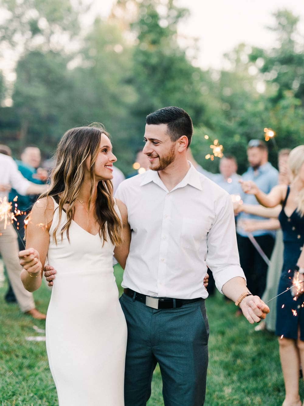 bride and groom portraits with sparklers during their intimate backyard wedding in cleveland Ohio