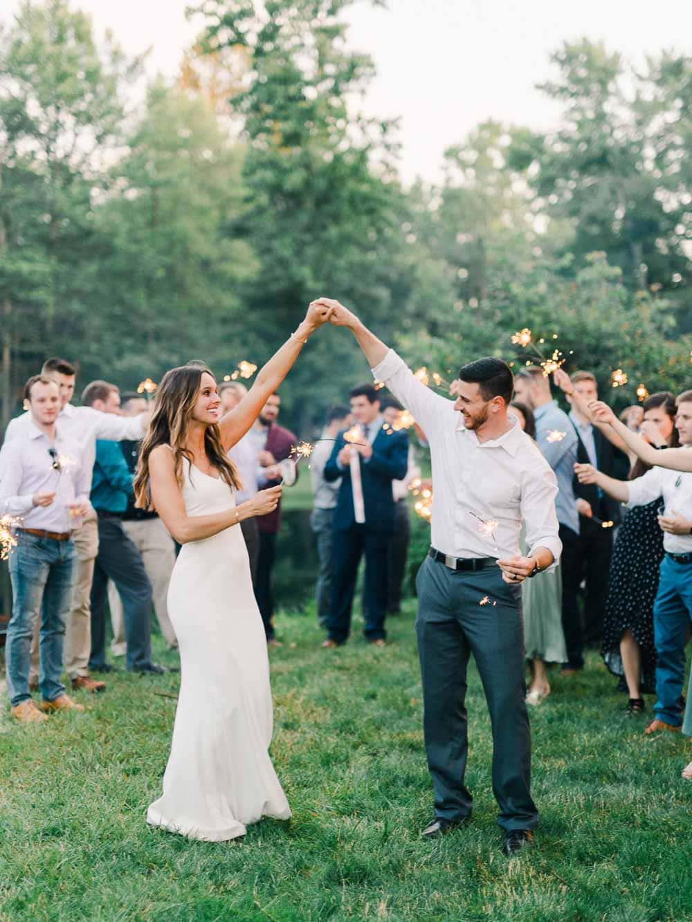 bride and groom sparkler exit portraits during their intimate backyard wedding in cleveland Ohio