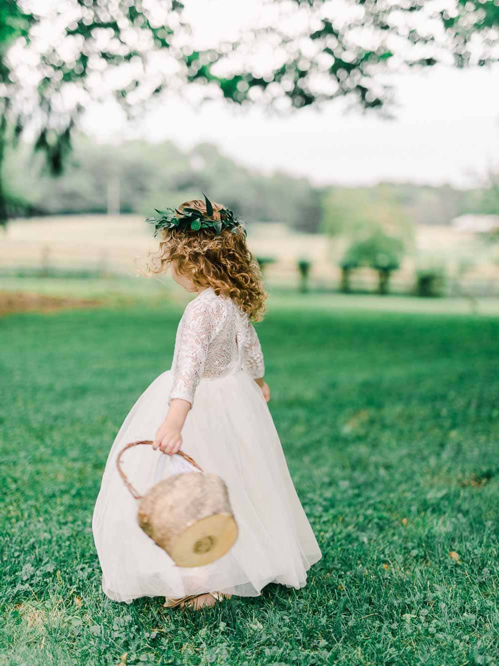 flower girl twirling during an intimate backyard wedding in cleveland Ohio