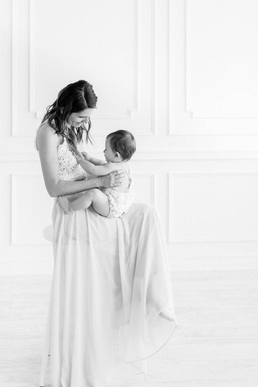 intimate moment between baby and mom during first birthday photoshoot