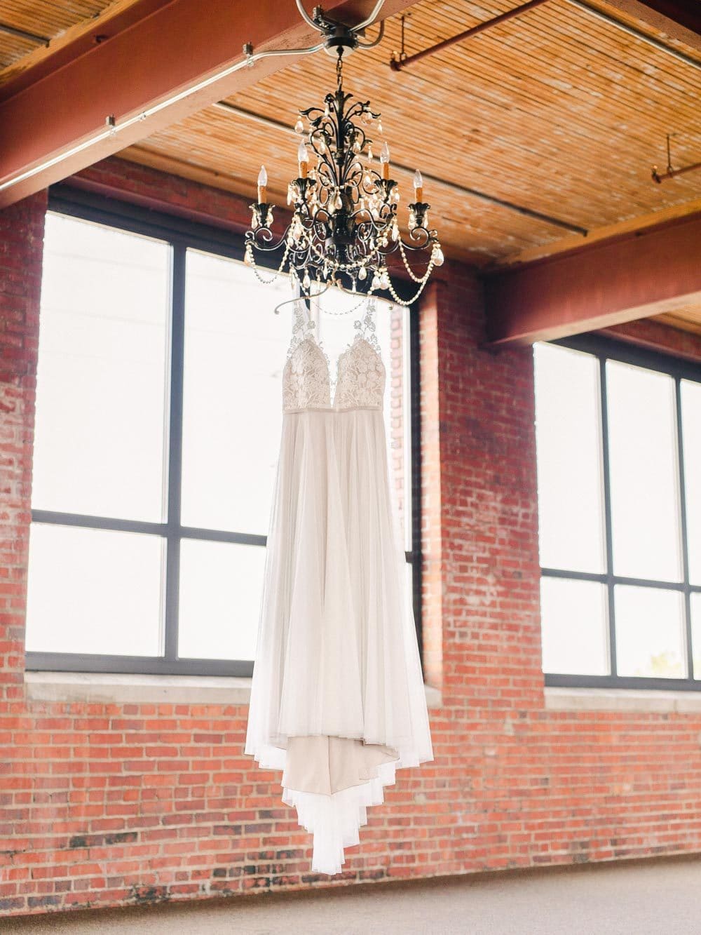 Ariel international center wedding, dress hanging from a chandelier 