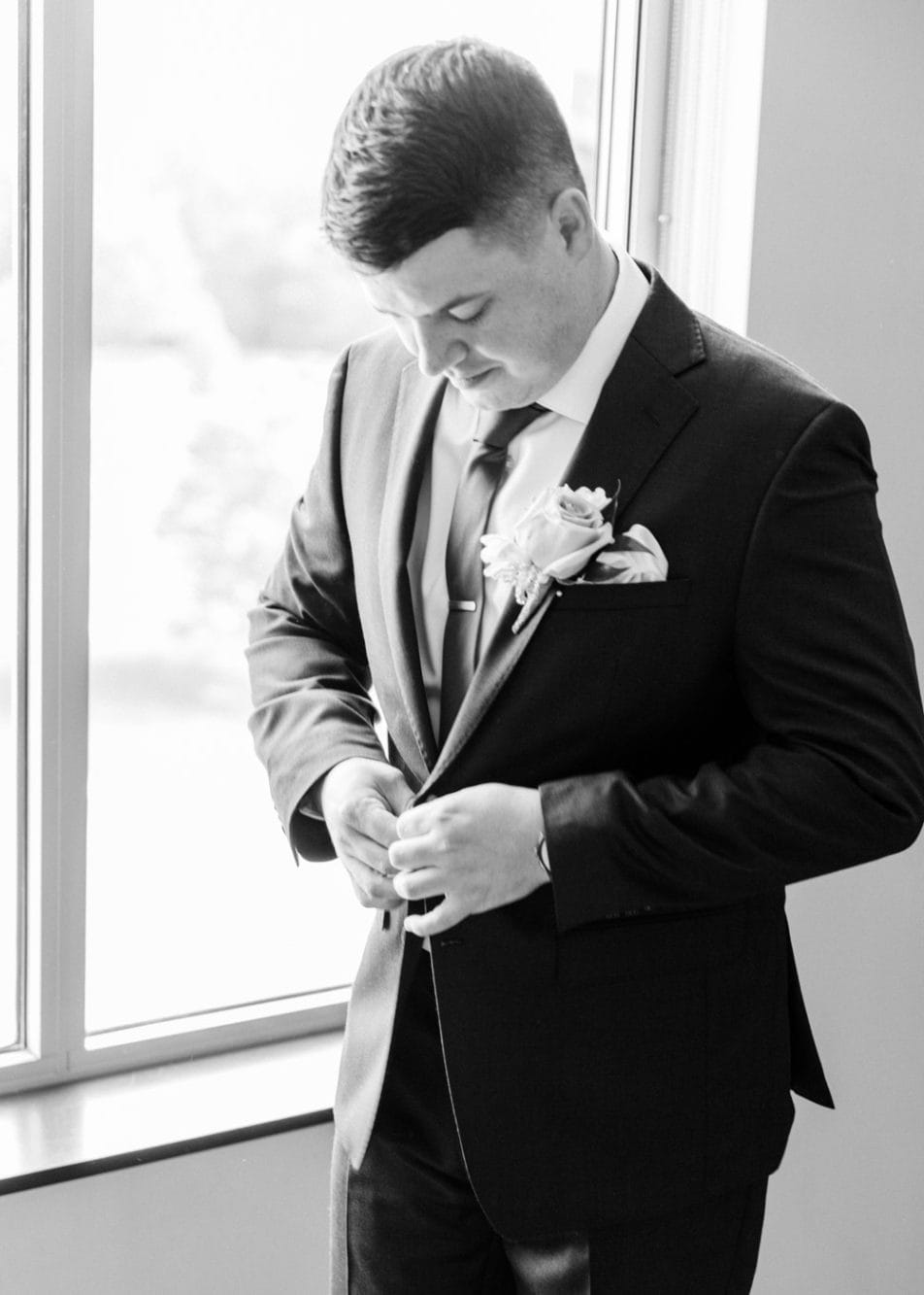 Groom getting ready photographed by Juliana Kaderbek Photography: Cleveland wedding photographer