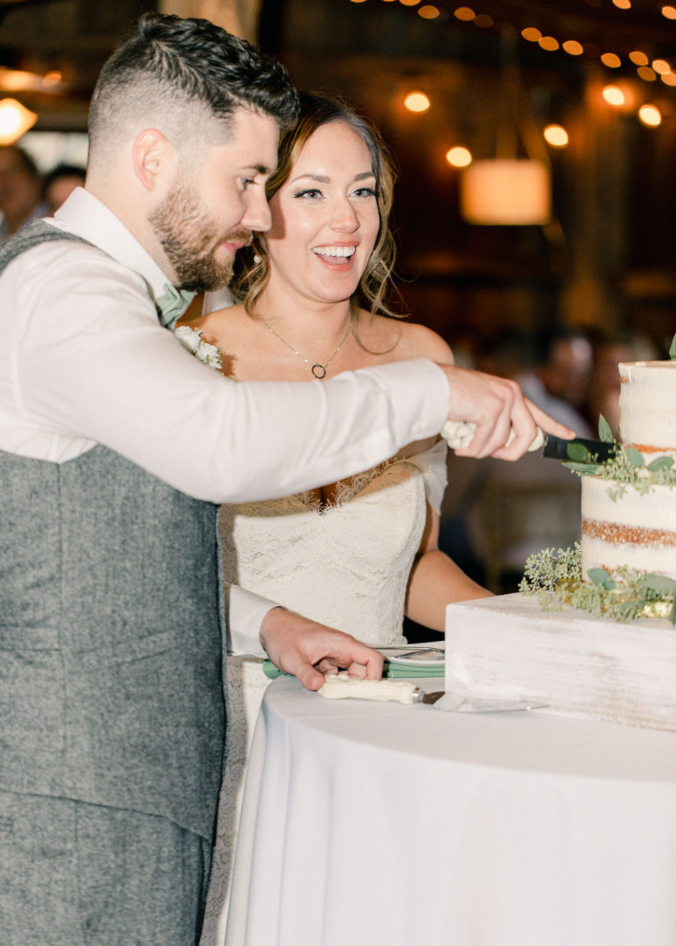 bride and groom cutting their cake