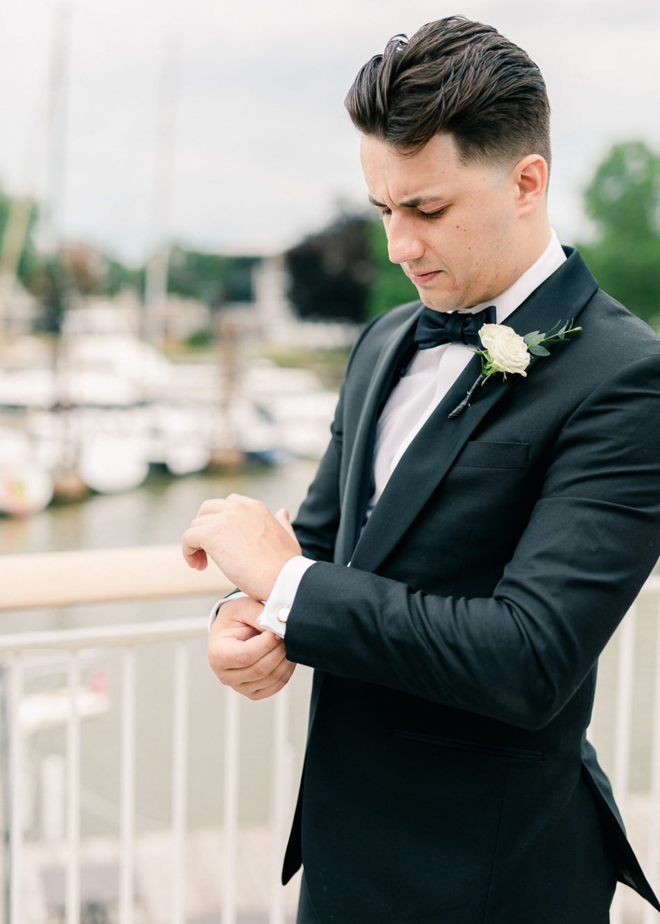 groom getting ready for his wedding at cleveland yacht club