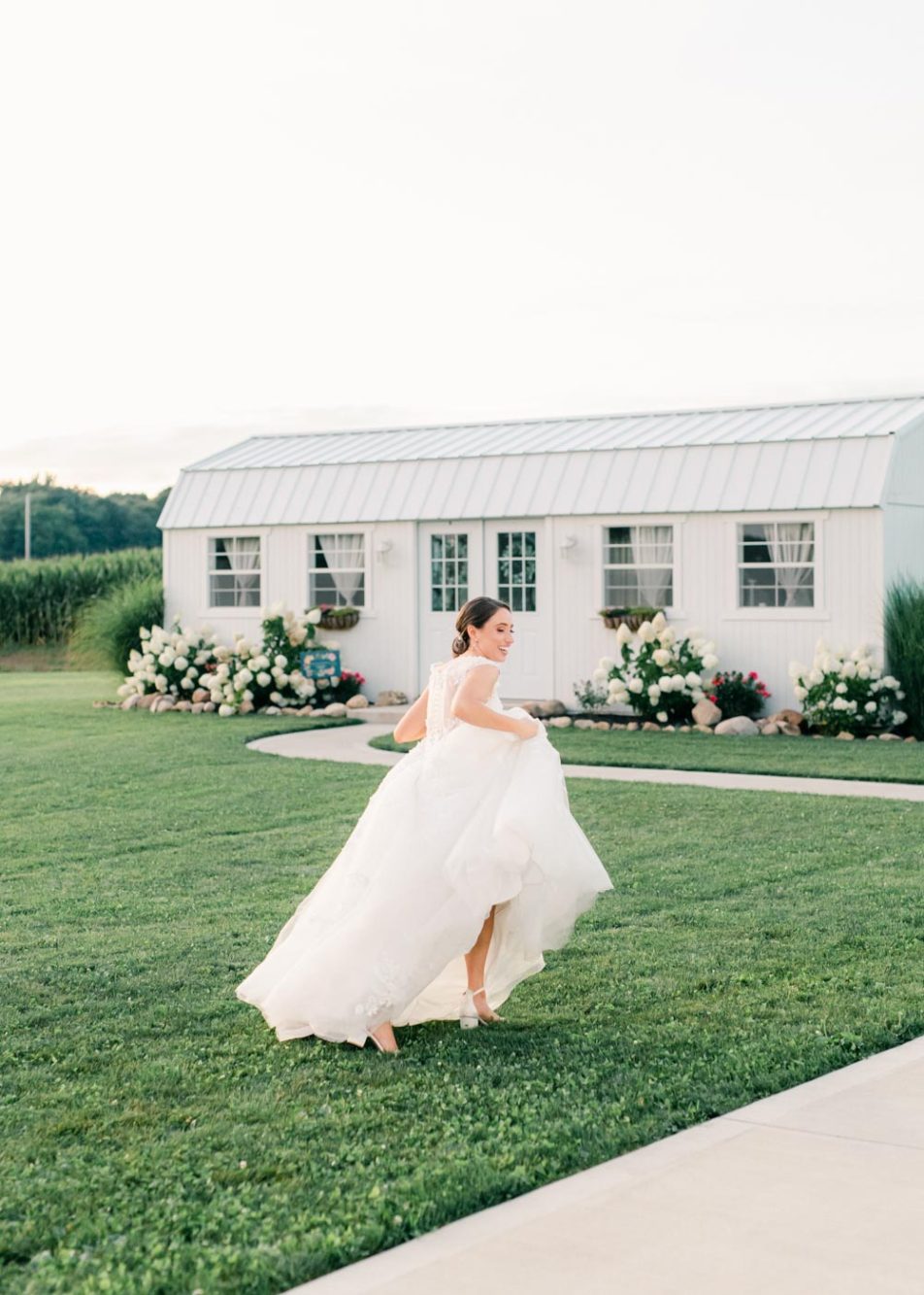 Bride running towards the bridal suite at White Rose Barn