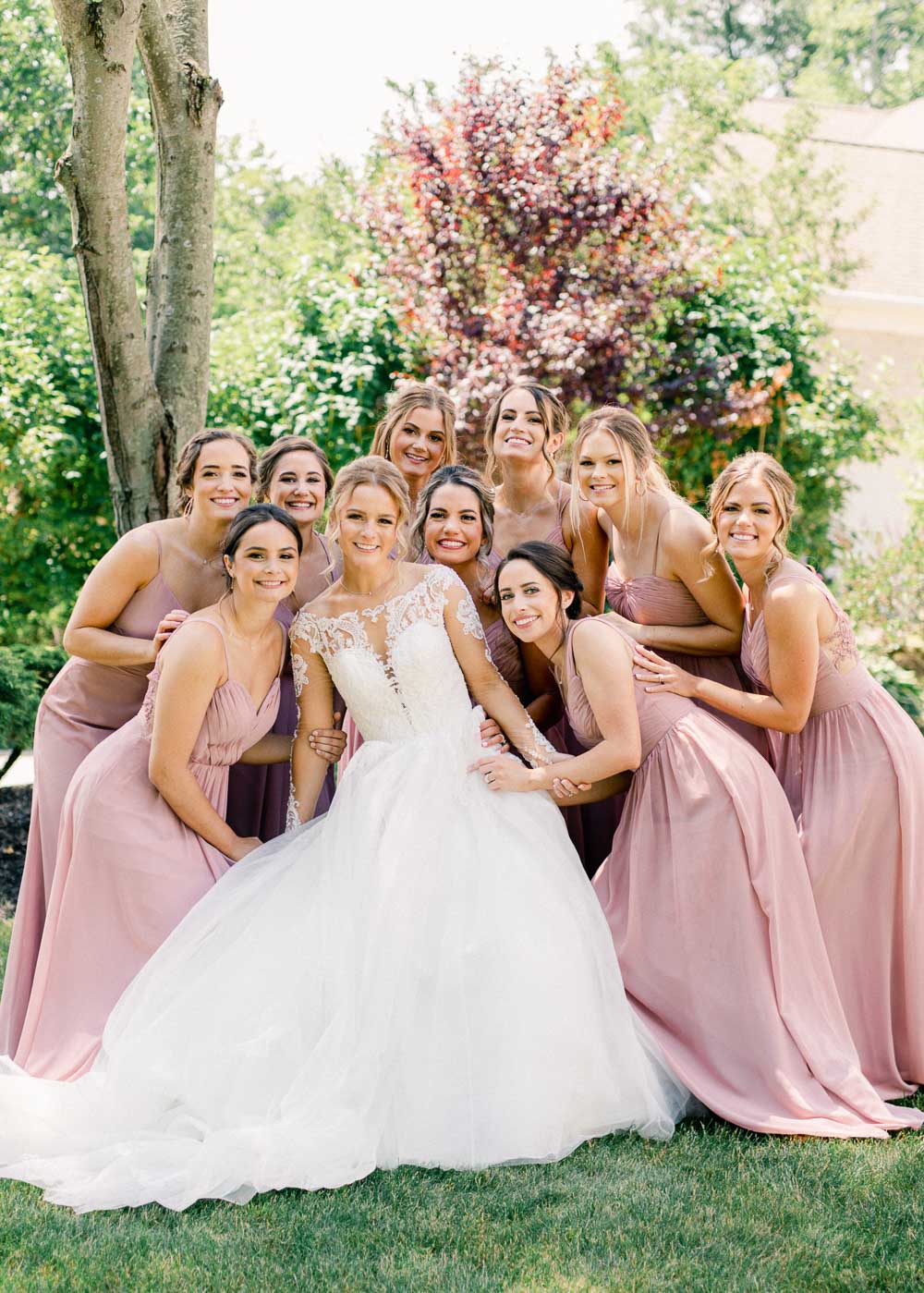 Bride getting ready with her bridesmaids photographed by Juliana Kaderbek Photography, Cleveland wedding photographer