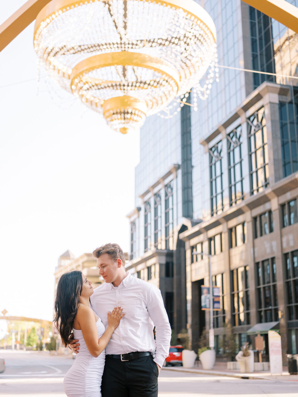Downtown Cleveland engagement photo under the GE chandelier 