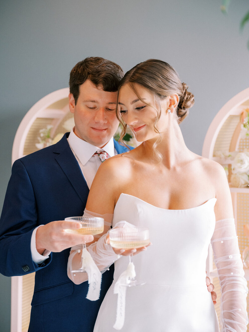 Bride and groom sharing a toast during their Orlando wedding photographed by Juliana Kae