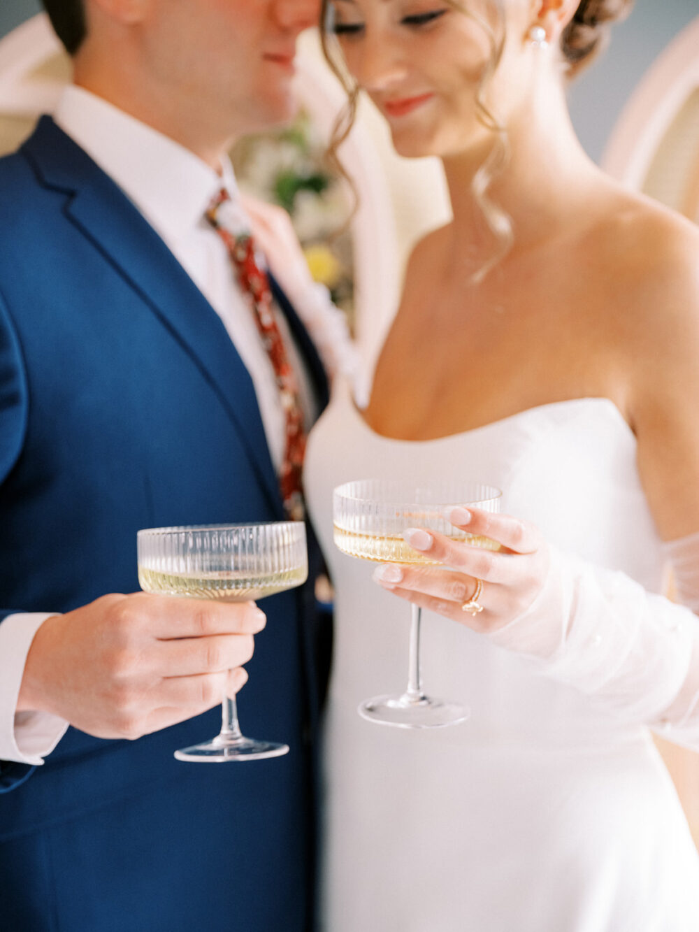 Bride and groom sharing a champagne during their Orlando wedding photographed by Juliana Kae