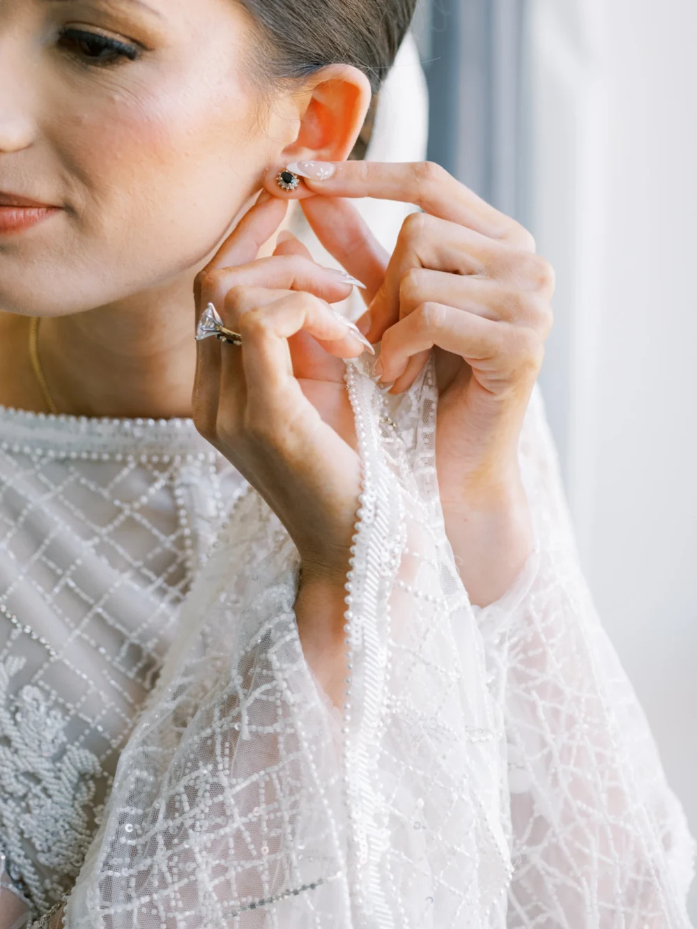Portrait of bride wearing J. Andreatta gown as she gets ready for her Cleveland wedding
