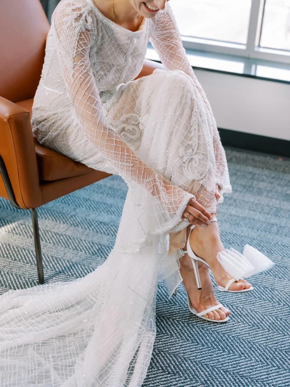 Bride wearing J. Andreatta gown and Jimmy Choo shoes as she gets ready for her Cleveland wedding