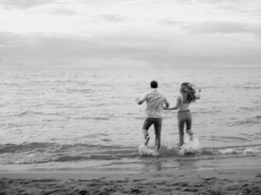 Bride and groom by the water during their engagement session in Columbia, SC