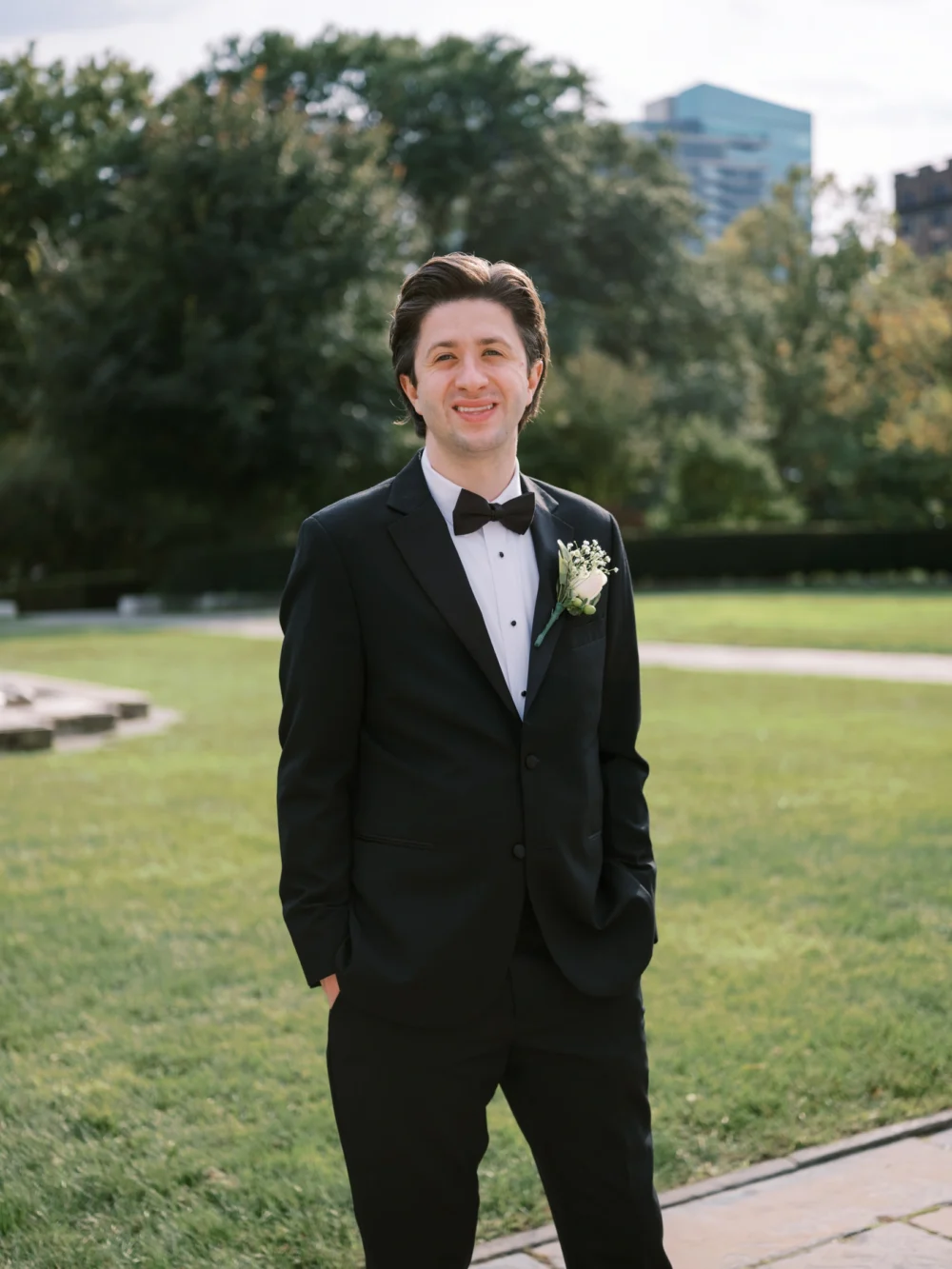 Groom portrait wearing a black suit at Cleveland Art Museum