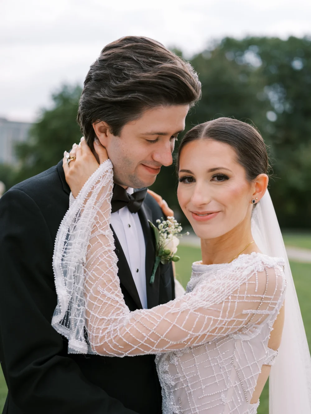 Bride and groom portrait at Cleveland Art museum, bride wearing J. Andreatta wedding dress