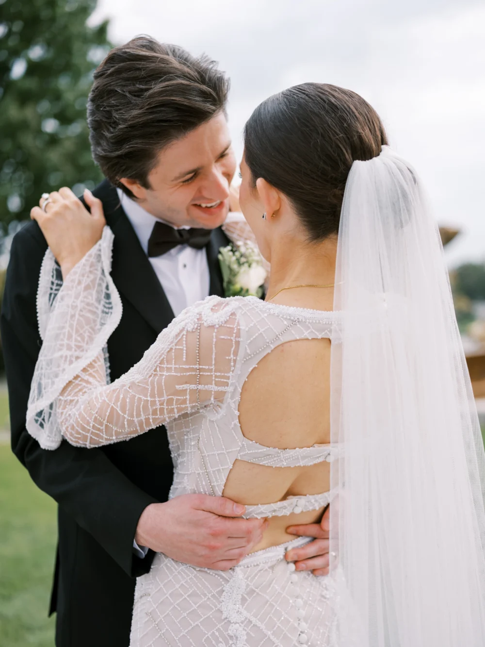 Bride and groom portrait at Cleveland Art museum, bride wearing J. Andreatta wedding dress