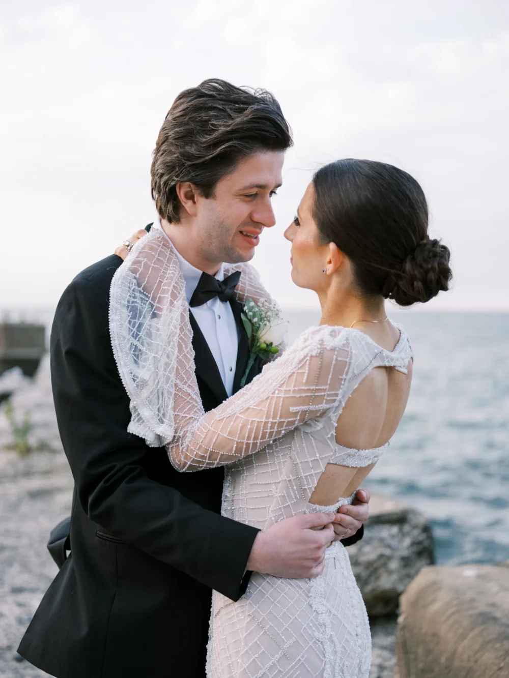 Bride and groom on the pier at Shoreby Club during their dream Cleveland wedding
