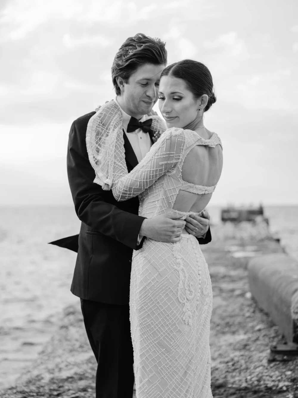 Bride and groom on the pier at Shoreby Club during their dream Cleveland wedding