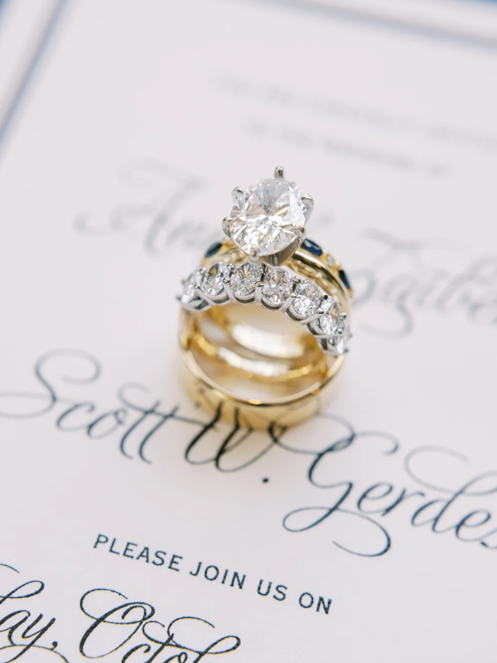 Detail of bride's wedding band and engagement ring