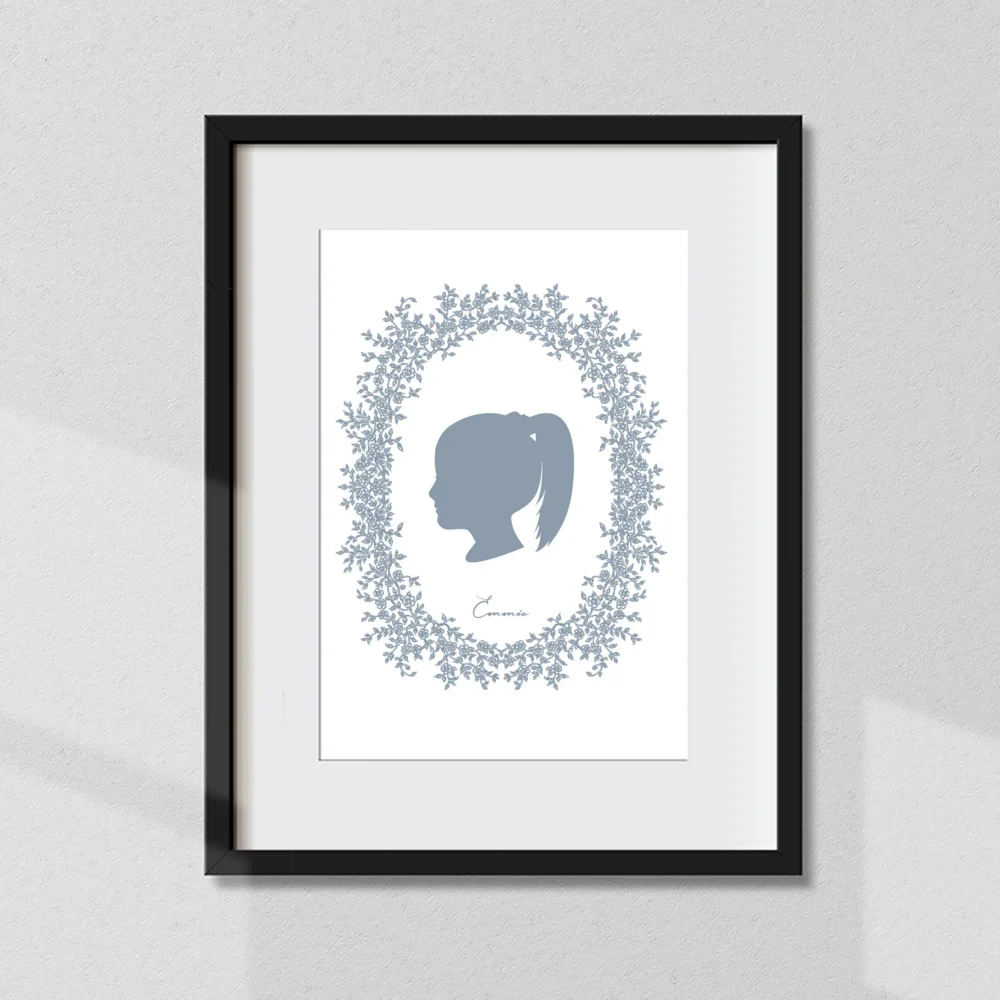 Custom heirloom silhouette from a photo, framed to be displayed in a home.
