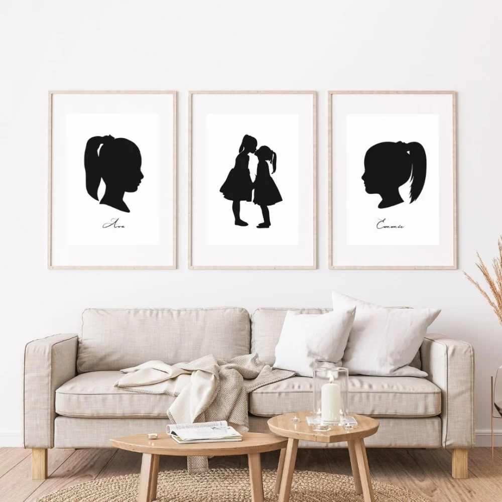 Heirloom silhouette artwork from photos, printed and framed on a wall.