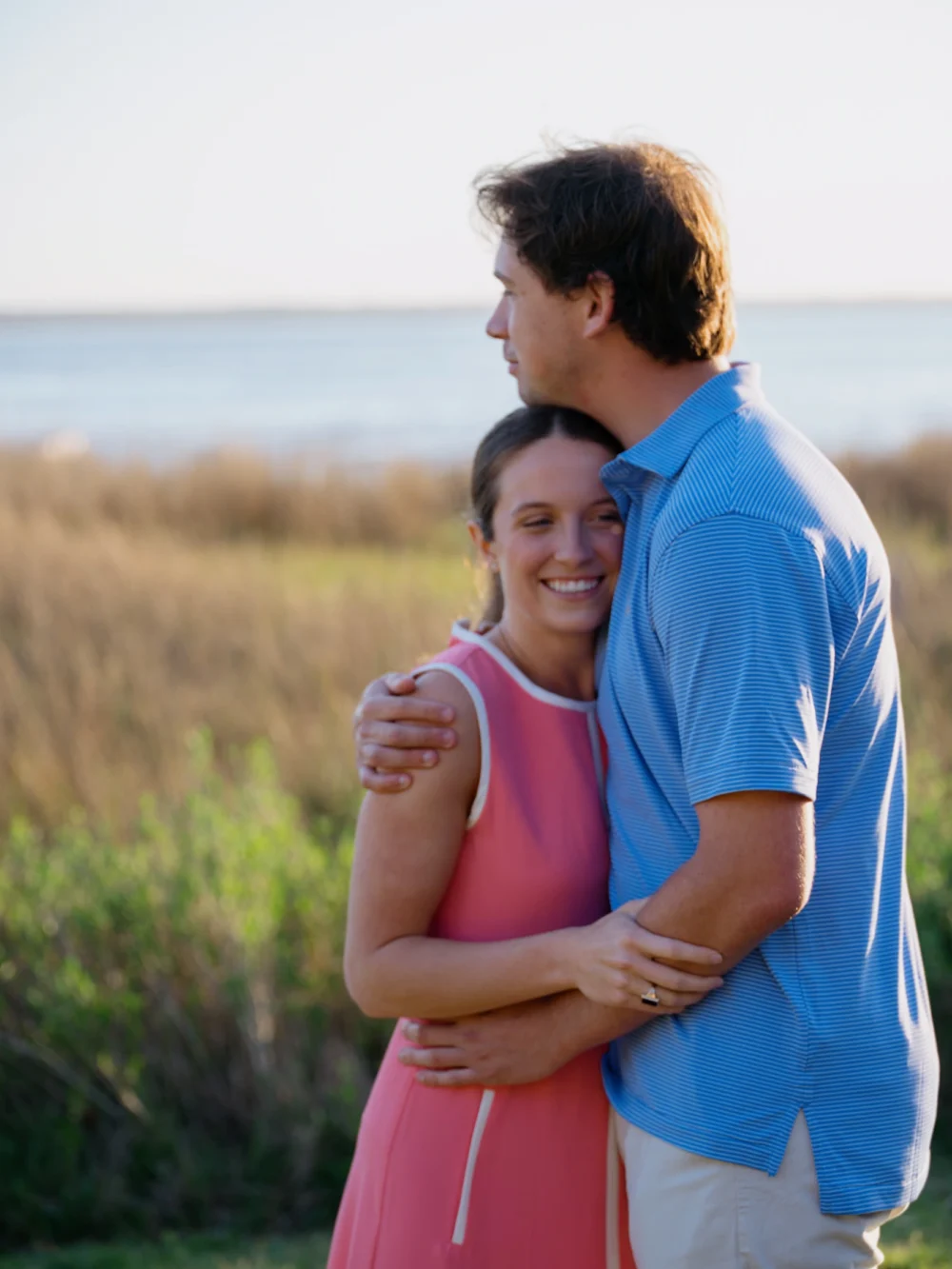 couple embracing after proposal in Charleston