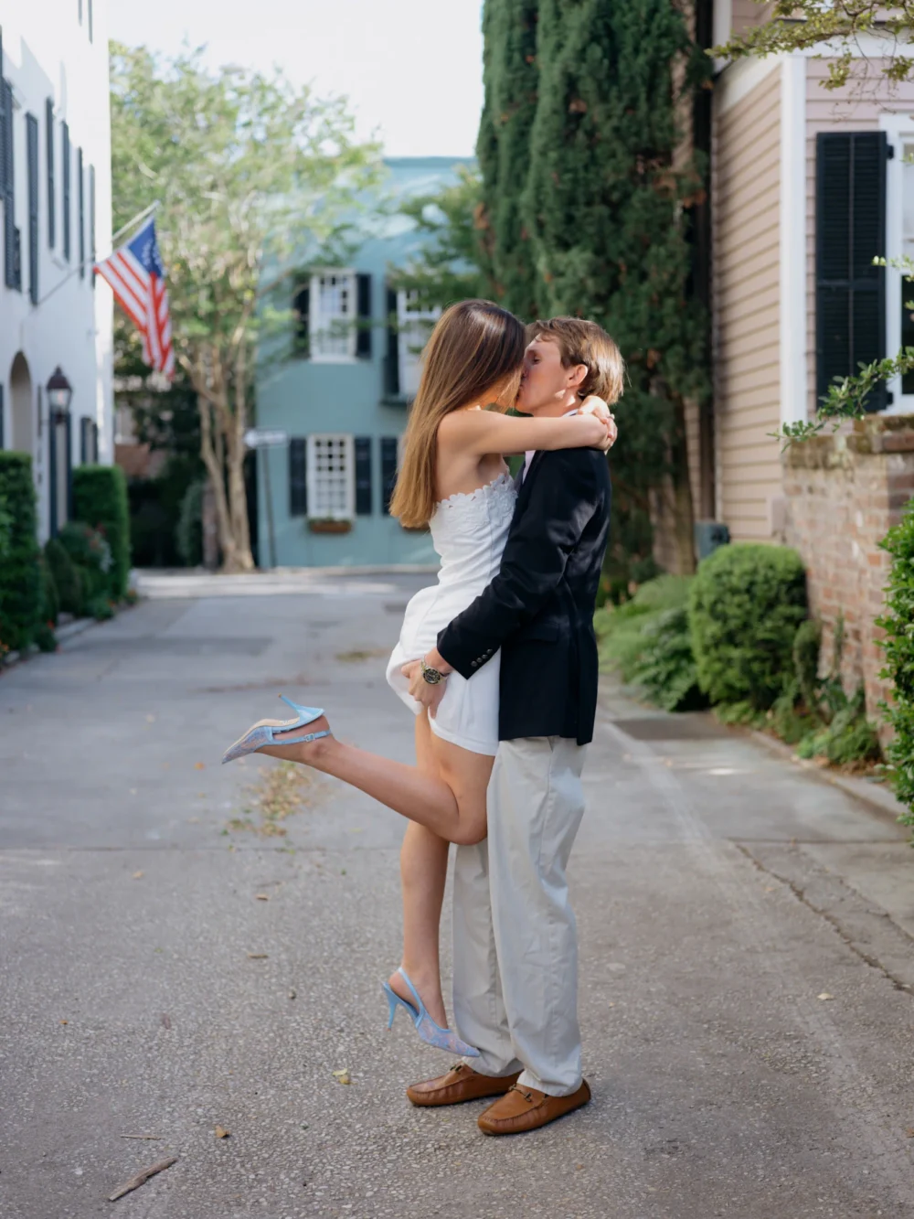 Engagement portraits near historic homes in downtown Charleston
