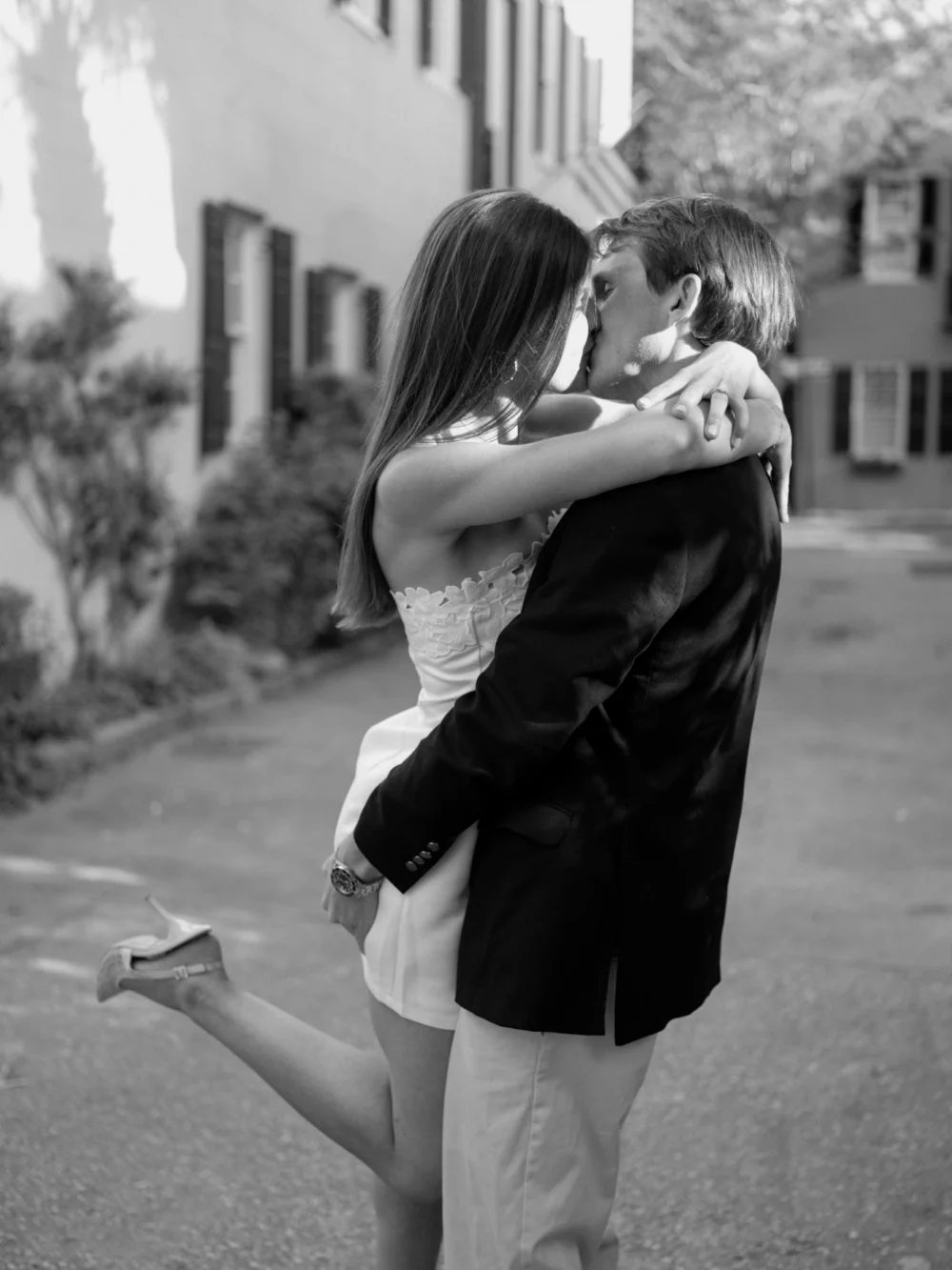 Engagement portraits near historic homes in downtown Charleston