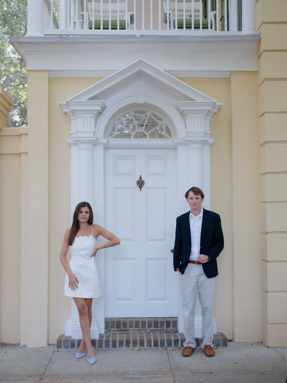 Engagement portraits near historic homes in downtown Charleston