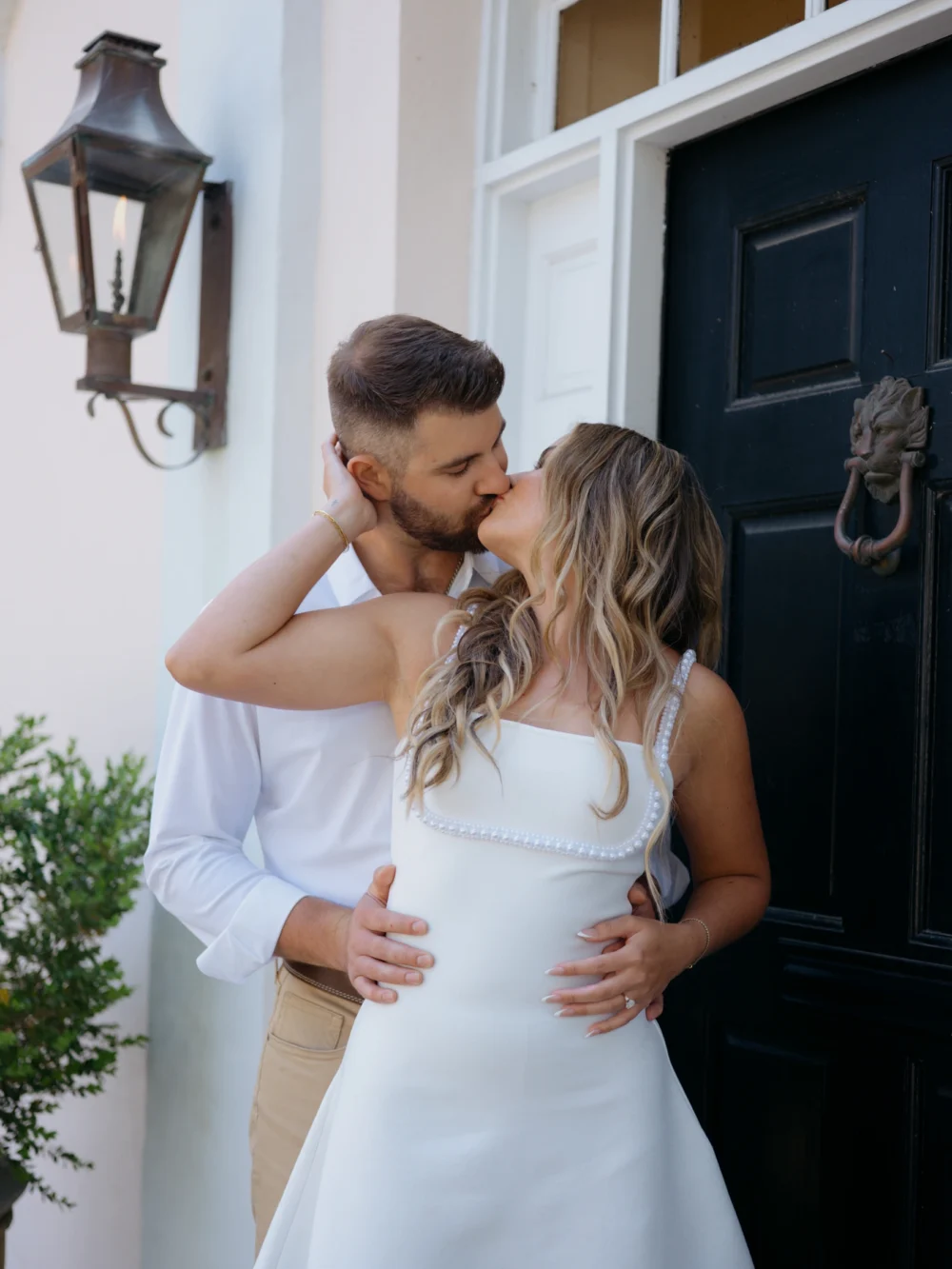 Couple embracing in Downtown Charleston historic district