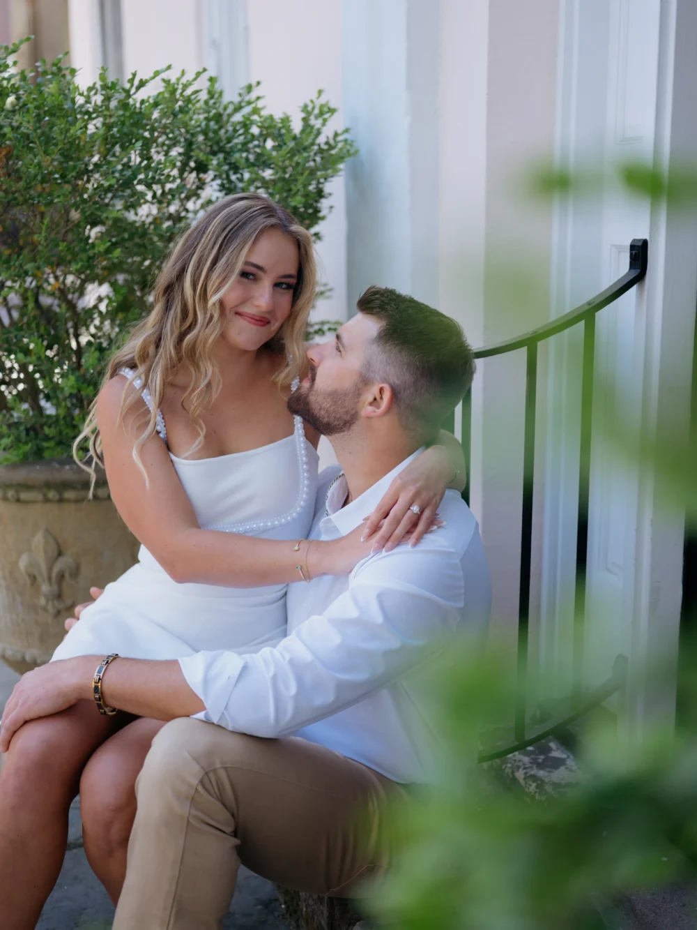 Couple embracing in Downtown Charleston historic district
