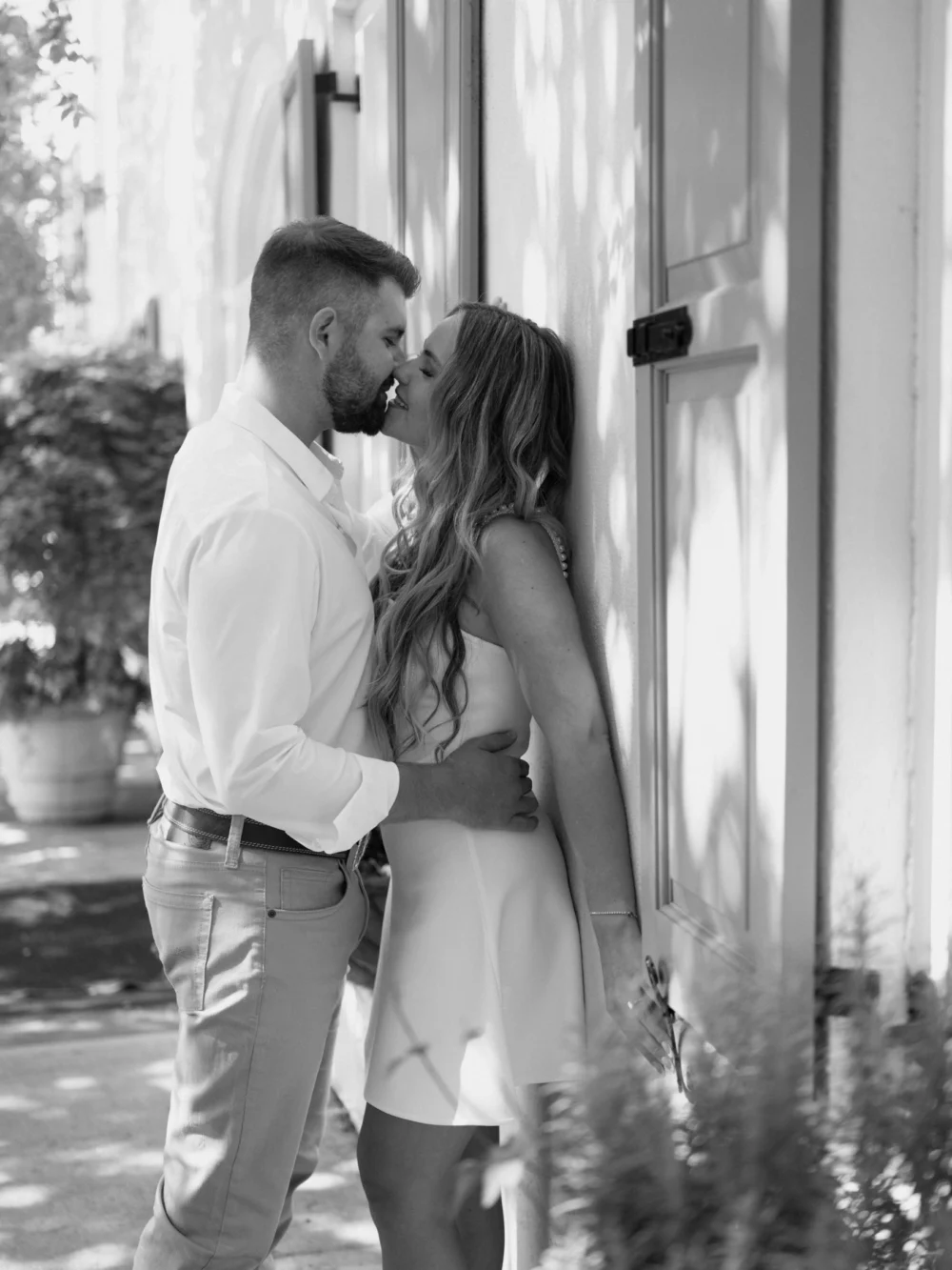 Couple embracing in Rainbow Row Downtown Charleston historic district