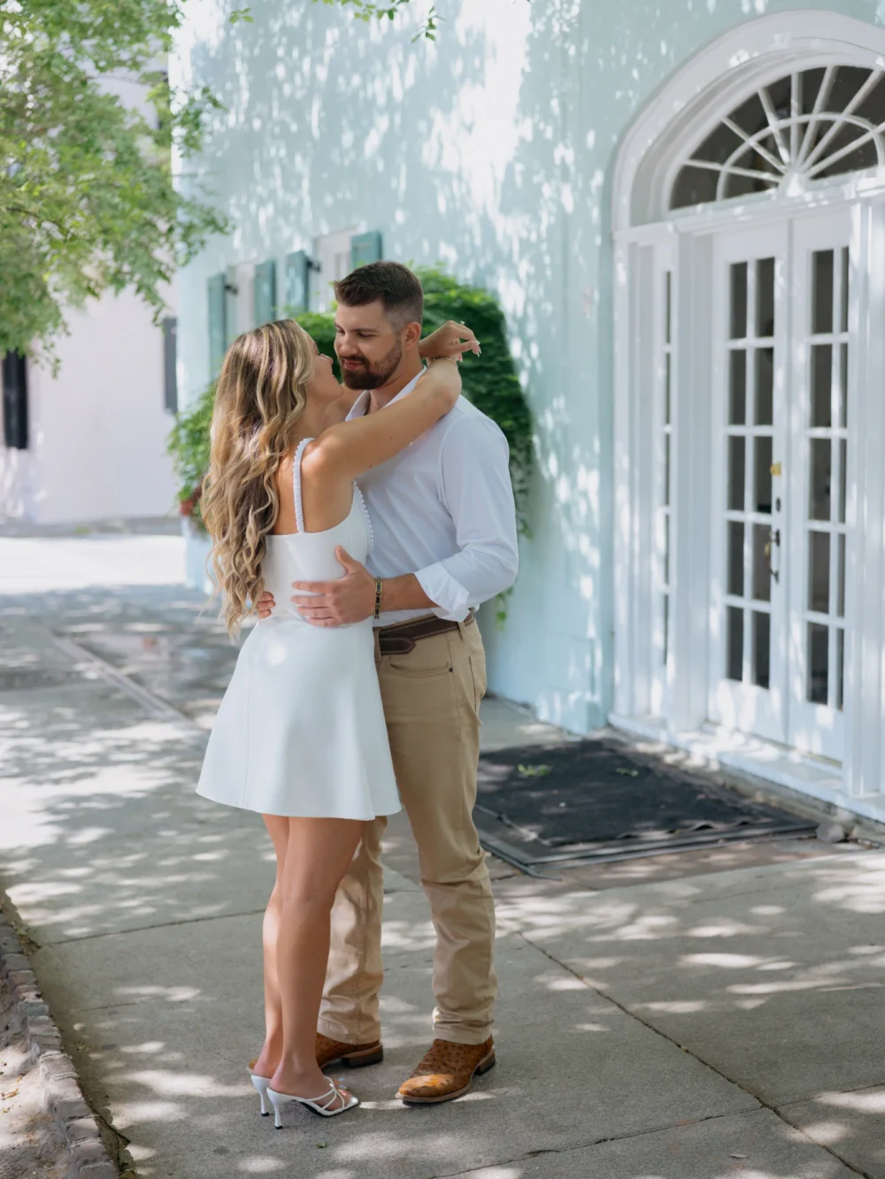 Couple embracing in Downtown Charleston historic district
