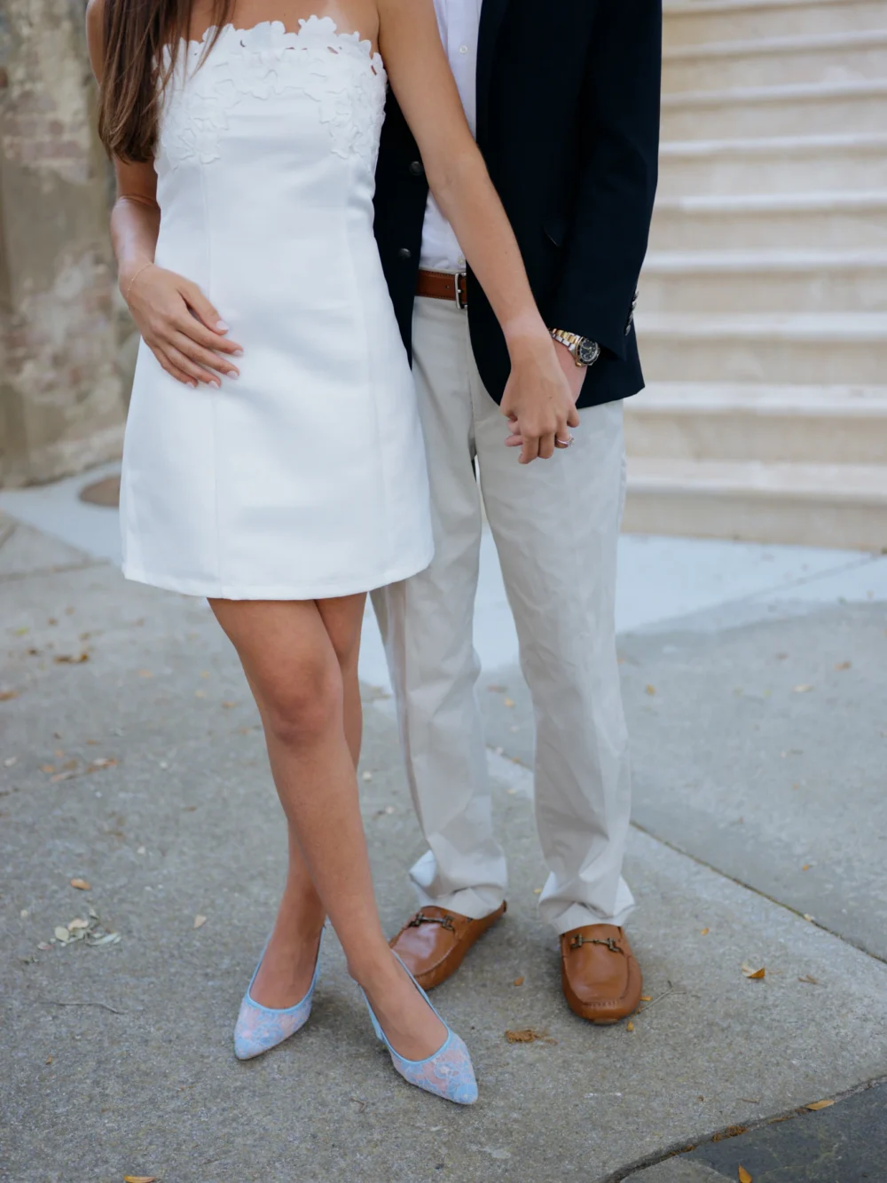 Bride-to-be in white babydoll dress during Charleston engagement session