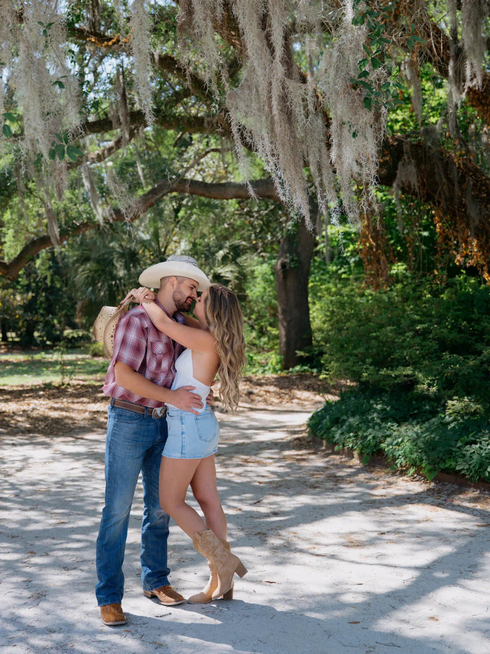 Romantic engagement photos under Spanish moss in Charleston