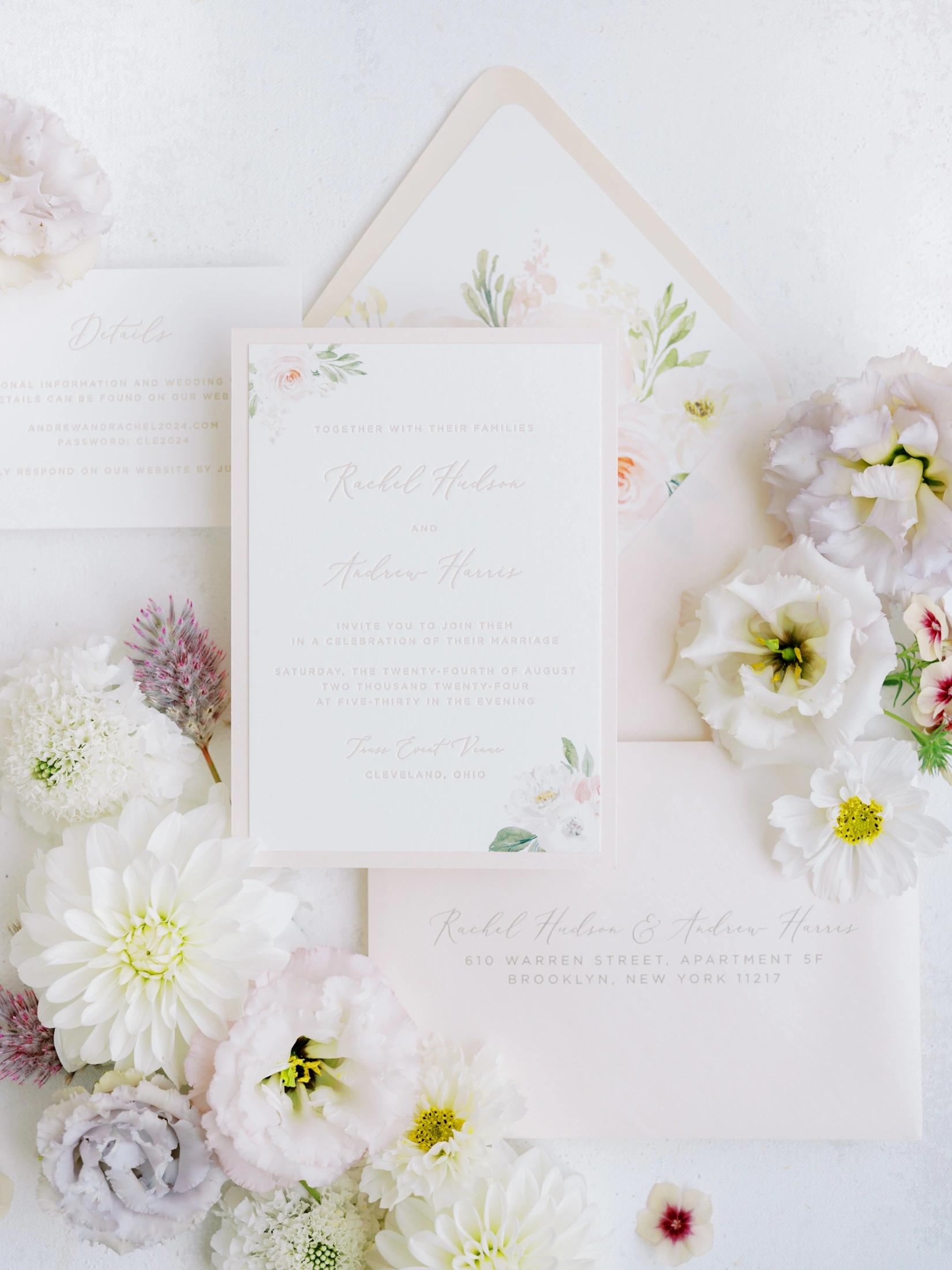 Elegant wedding invitation suite with envelope and floral details